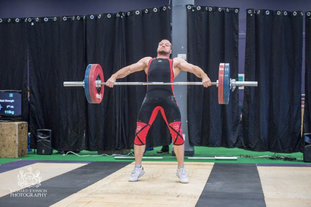 Kody Taylor performing a clean and jerk in a competition