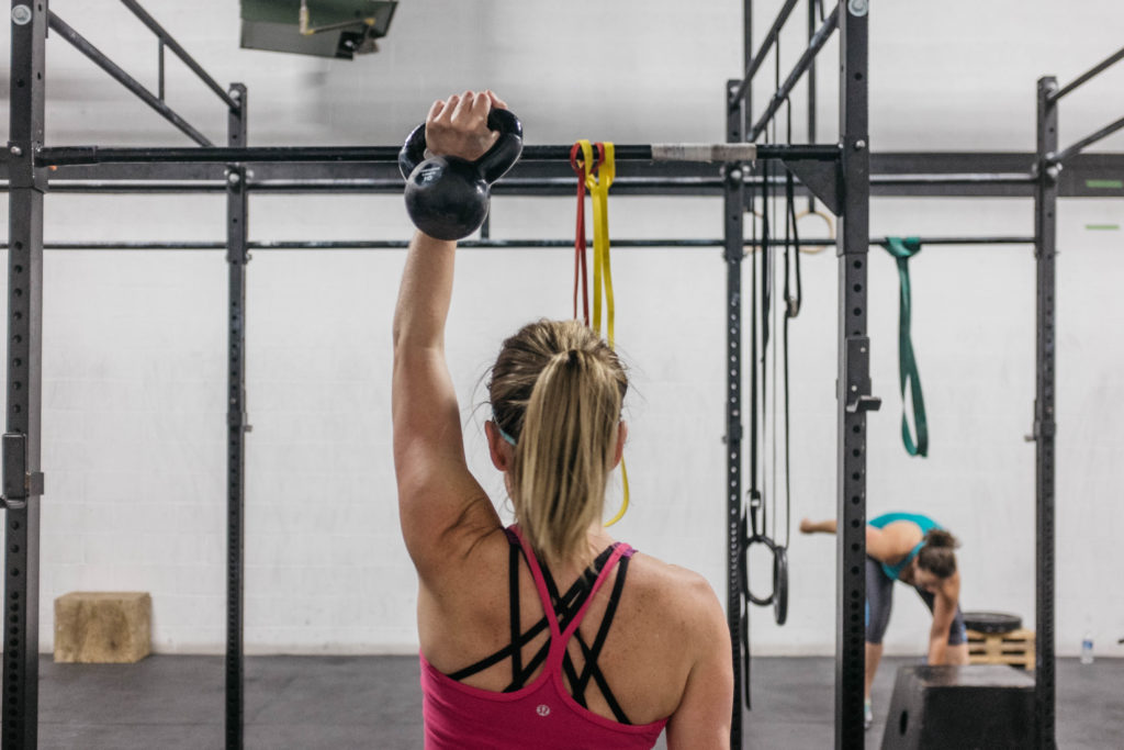 woman doing Crossfit with a kettlebell